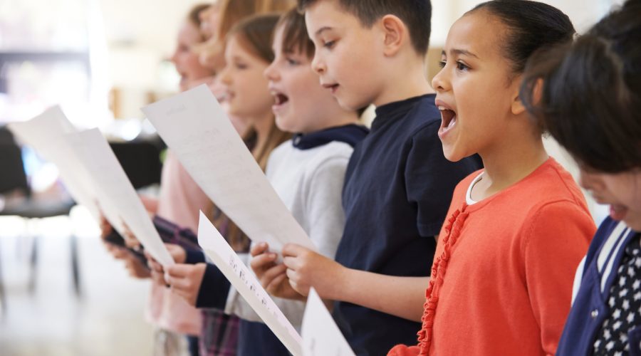 Group,Of,School,Children,Singing,In,Choir,Together Group,Of,School,Children,Singing,In,Choir,Together